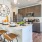 a kitchen with a island and chairs