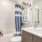 a bathroom with a tub sink and toilet