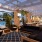 a patio with a pool and chairs