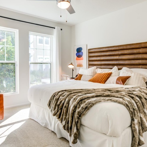 Beautiful bedrooms to fit every need a bedroom with a bed and a fan