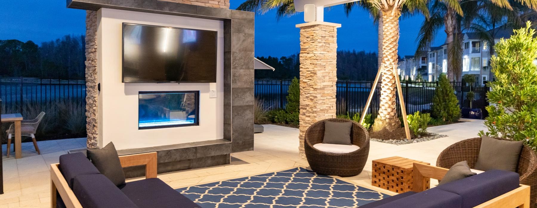 outdoor patio with tv and fireplace