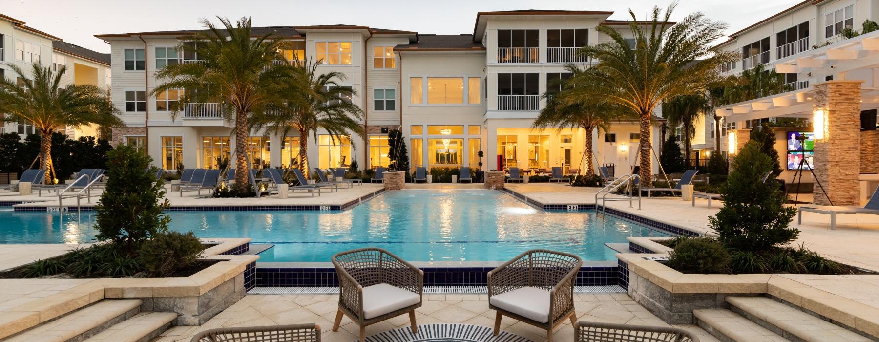 a pool with chairs around it