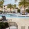 a pool with chairs around it
