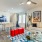 a living room with a table and chairs