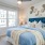 a bedroom with a bed and a desk